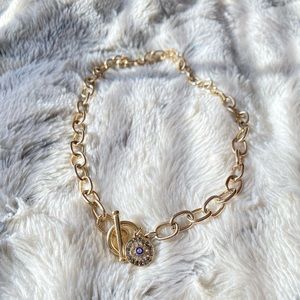 Gold chain with emblem